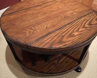 Industrial Style Round Coffee Table with Casters and Lower Shelf
