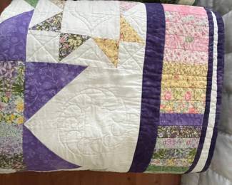 Hand-Quilted Patchwork Quilt with Floral and Geometric Patterns
