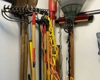 Assorted Garden Tools and Metal Detector on Rubbermaid FastTrack System