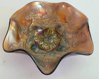 Fenton Carnival glass bowl with grape leaf pattern and a dramatic ruffled edge