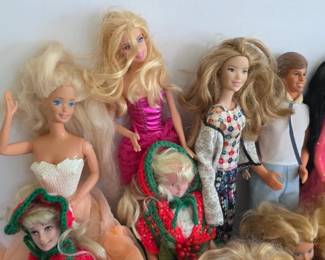 Assortment of Barbie and Ken dolls