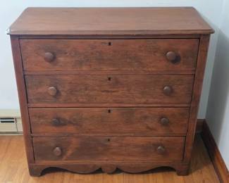 Four drawer antique chest with wood knobs