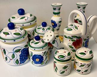 Vintage 1990s JAY Imports hand-painted ceramic kitchen collection, featuring cheerful floral-and-fruit designs with signature cobalt-blue knobs. Includes matching canisters, teapot, watering-can-style pitcher, salt-and-pepper shakers, and coordinating decorative vases.