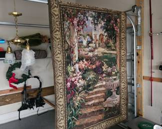 This very large tapestry with a rod is left over from a previous estate sale $50 I just washed it and dried it yesterday so it's nice and fresh