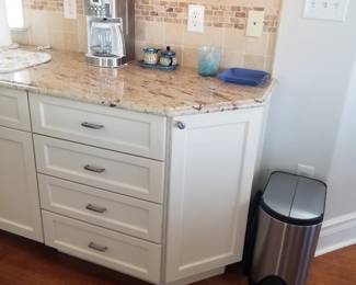 Kitchen feature: drawers; step trash can
