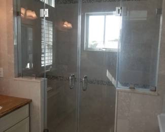 Glass shower enclosure