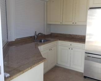 Pool cabana: cabinets; wet bar; electric hurricane shutters