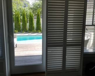 Plantation shutters for sliding glass doors