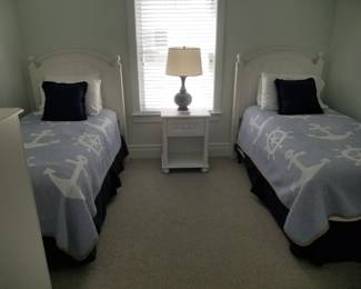 Twin beds; nightstand; table lamp
