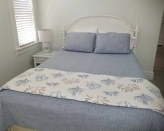 Queen bed; nightstand; table lamp