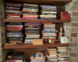 Bookcase full of various books, cookbooks, and Christian books too.