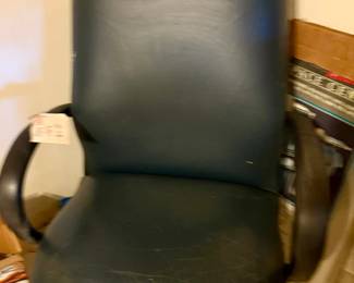 Dark teal rolling desk chair with dark wood rolled arms
