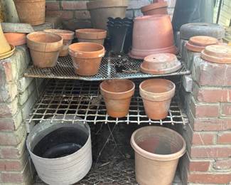 Lots of old clay pots and rectangular planters