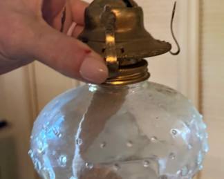 Several old glass oil lamps and lots of globes