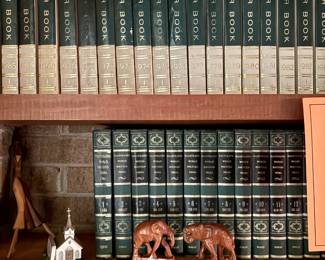 Old encyclopedia sets and leather bound National Geographic magazines.