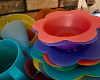 Lg. selection of colorful plastic plates, bowls, utensils, and pitcher