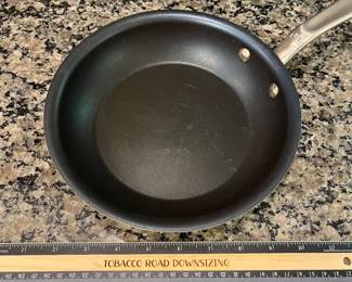 H96 - $85. 4 Piece Set. Made - In Fying Pan Set with Universal Lid. They show signs of wear.