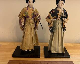 H124 - $60. Pair of Vintage Kurodabush Samurai Dolls. One is missing a thumb. Each Measures 11.5" Tall.
