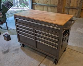 H104 - $250. Husky Tool Box - Mobile Work Bench. Measures 46” W x 25” D x 37.35 Tall. Excellent Condition.