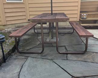 H11 - $75. Picnic Table with Umbrella. Measures 74” W x 60” D x 28.5” Tall. Fair condition - sturdy but a bit weathered.