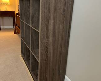 H75 - $30. 9 Cube Bookshelf. Measures 44“ W x 14.5“ D x 44” Tall.