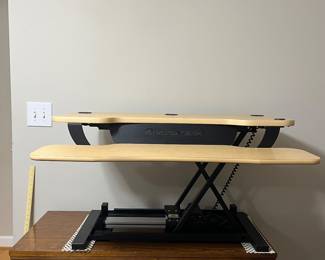 H83 - $100. VersaDesk Power Pro Electric Standing Desk. Measures 36” Wide. Raises up to 20” high.