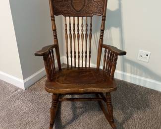 H61 - $65. Antique Rocking Chair with leather seat. Measures 25” W x 30“ D x floor to seat 16” x floor to back 38.5“ Tall.