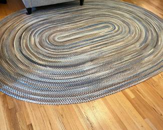 H22 - $225. Braided Rug. Measures 102” W x 132” Long. Lays perfect but it does have some "holes" where it should be sewn together. Would be easy to hand stitch back together if you wanted.