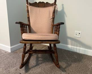 H61 - $65. Antique Rocking Chair with leather seat. Measures 25” W x 30“ D x floor to seat 16” x floor to back 38.5“ Tall.