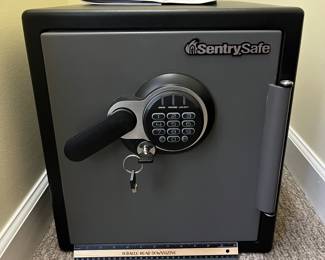 H85 - $100. Sentry Safe Model SFW123GTC. Fire & Water Safe. Key Lock and Electronic Lock. Measures 16" W x 17" D x 18" Tall.