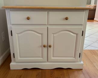 H57 - $60. White Cabinet. Single Drawer with Storage Cabinet below. Measures 38” W x 18” D x 31” Tall.