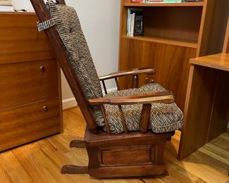 H38 - $75. Wooden Rocking Chair with Metal Accent. Measures 26.5” W x 36” D x floor to seat 18” x floor to back 44” Tall. Sturdy and very good condition.