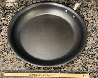 H96 - $85. 4 Piece Set. Made - In Fying Pan Set with Universal Lid. They show signs of wear.
