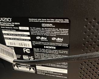 H24 - $120. 55” Vizio TV Model M55-C2 on Chrome Stand. TV on Stand Measures 59.5” Tall.