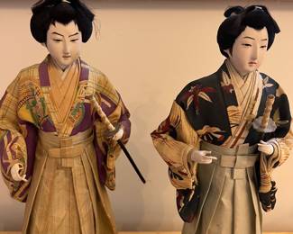 H124 - $60. Pair of Vintage Kurodabush Samurai Dolls. One is missing a thumb. Each Measures 11.5" Tall.