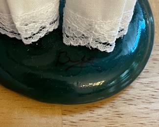 H126 - $40. Signed by Joyce Bayer. Byers' Choice "The Carolers" Lady with Flowers. Measures 9.5" Tall.