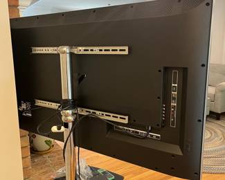 H24 - $120. 55” Vizio TV Model M55-C2 on Chrome Stand. TV on Stand Measures 59.5” Tall.