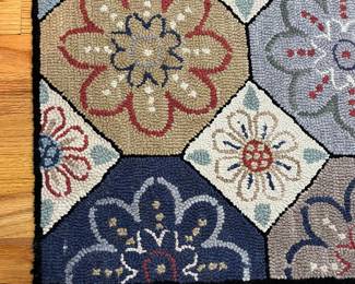 H50 - $95. Hooked Wool Rug. Measures 71” W x 109” Long.