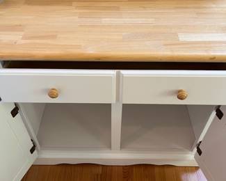 H57 - $60. White Cabinet. Single Drawer with Storage Cabinet below. Measures 38” W x 18” D x 31” Tall.