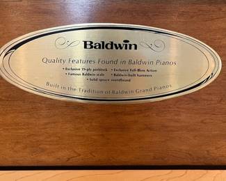 H46 - $100. Baldwin Upright Piano. Serial #1196036. Made In The USA. Measures 59” W x 29” D x 40” Tall. YOU MUST HIRE MOVERS. Located on the first floor - about 20' into the house.