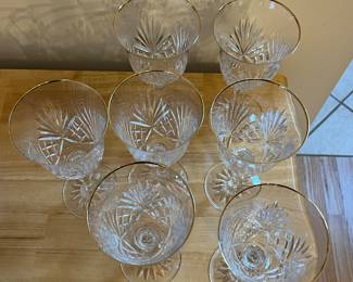 H87 - $80. 7 Piece Set. Miller Rogaska Gold Rim Water Goblets. Measures 8" Tall. Minor wear on gold.