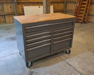 H104 - $250. Husky Tool Box - Mobile Work Bench. Measures 46” W x 25” D x 37.35 Tall. Excellent Condition.