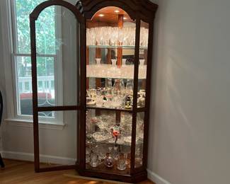 H56 - $225. Lighted Corner Display Cabinet. 3 Adjustable Glass Shelves. Measures 36“ W x 24” D x 78” Tall. Excellent Condition.
