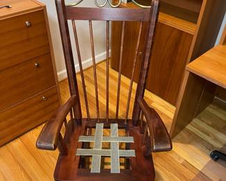 H38 - $75. Wooden Rocking Chair with Metal Accent. Measures 26.5” W x 36” D x floor to seat 18” x floor to back 44” Tall. Sturdy and very good condition.
