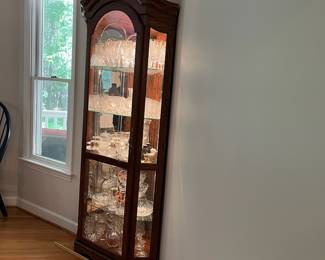 H56 - $225. Lighted Corner Display Cabinet. 3 Adjustable Glass Shelves. Measures 36“ W x 24” D x 78” Tall. Excellent Condition.