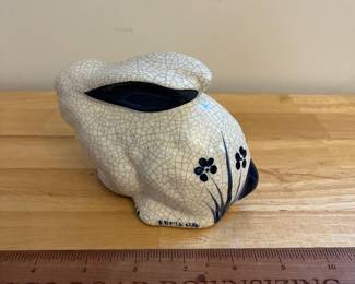 H130 - $20. Dedham pottery Bunny. Measures 6.5" W x 3.25" Tall.
