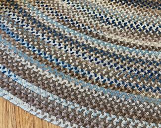 H22 - $225. Braided Rug. Measures 102” W x 132” Long. Lays perfect but it does have some "holes" where it should be sewn together. Would be easy to hand stitch back together if you wanted.