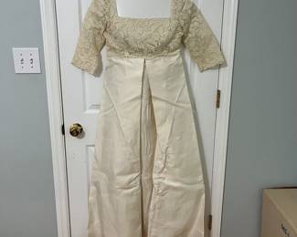 H101 - $100. Vintage Wedding Dress. Tag Reads "Specially Hand Made and Fashioned by Marian Bingaman." Waist measures 30".