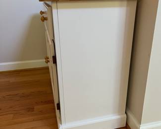 H57 - $60. White Cabinet. Single Drawer with Storage Cabinet below. Measures 38” W x 18” D x 31” Tall.