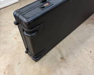 H112 - $75. 53" Rolling Tactical Hard Case. Measures 53" x 15.5" x 5".